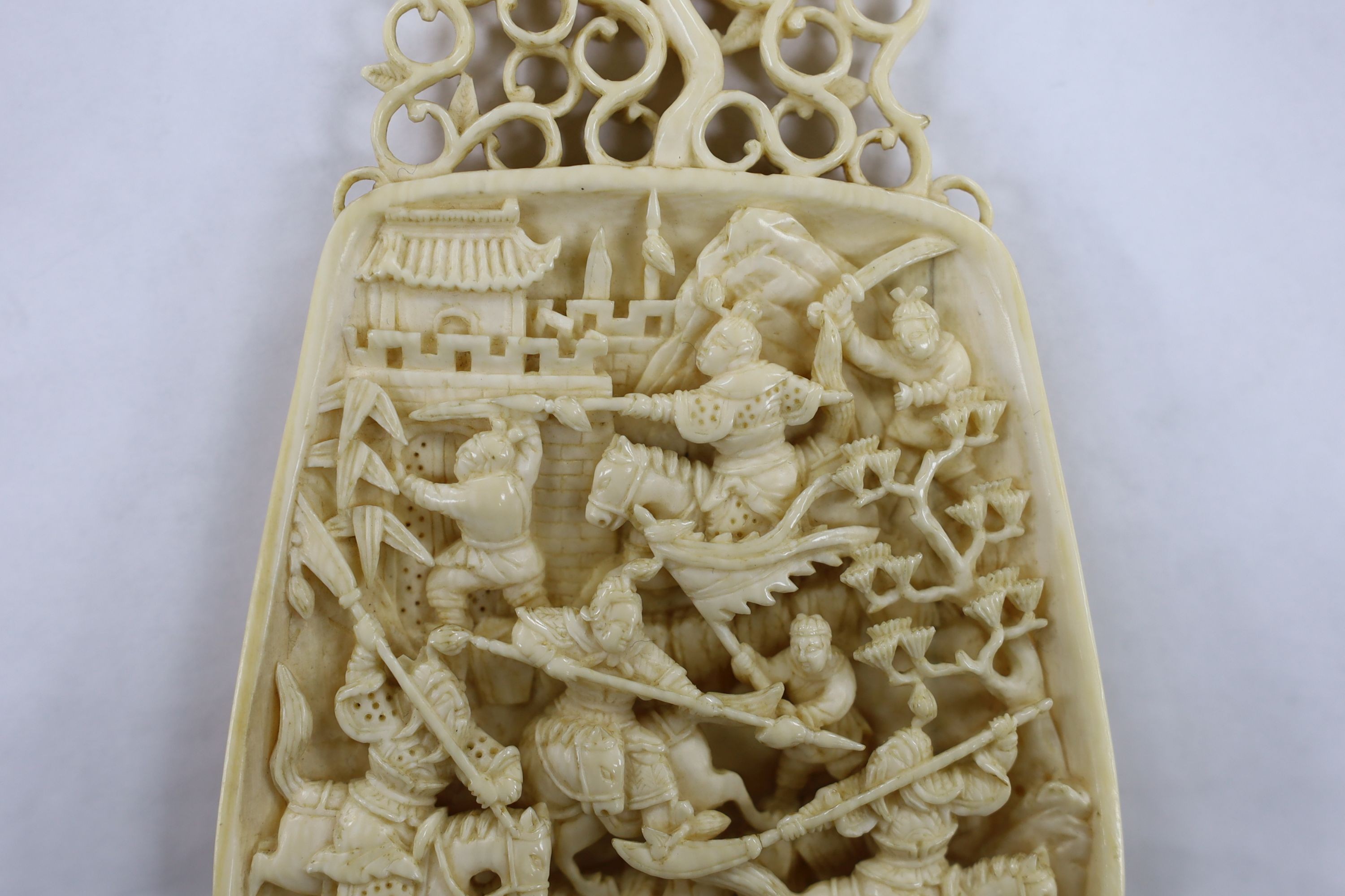 A 19th century Chinese ivory carving, warrior scene, 13cm high